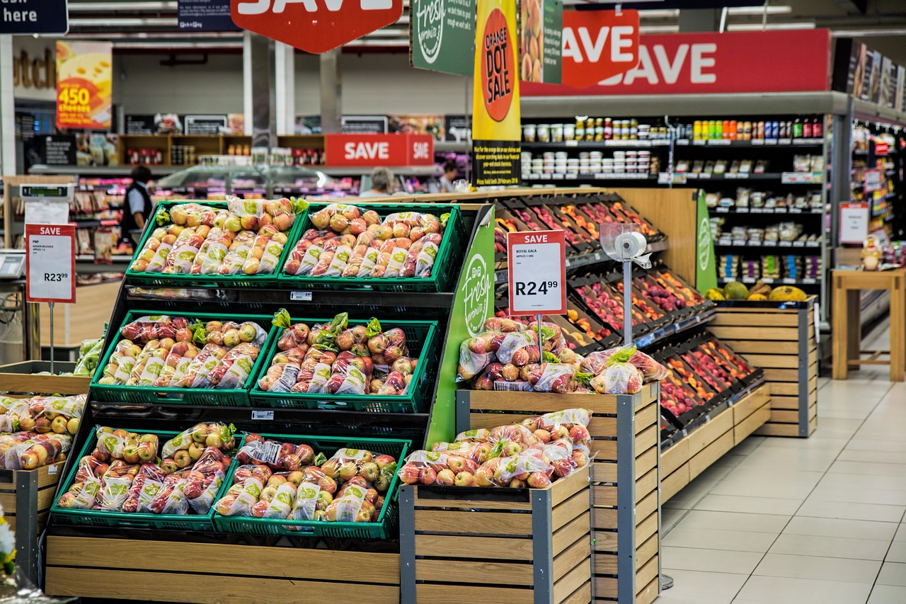 Shop assistant scanning a product barcode with retail technology